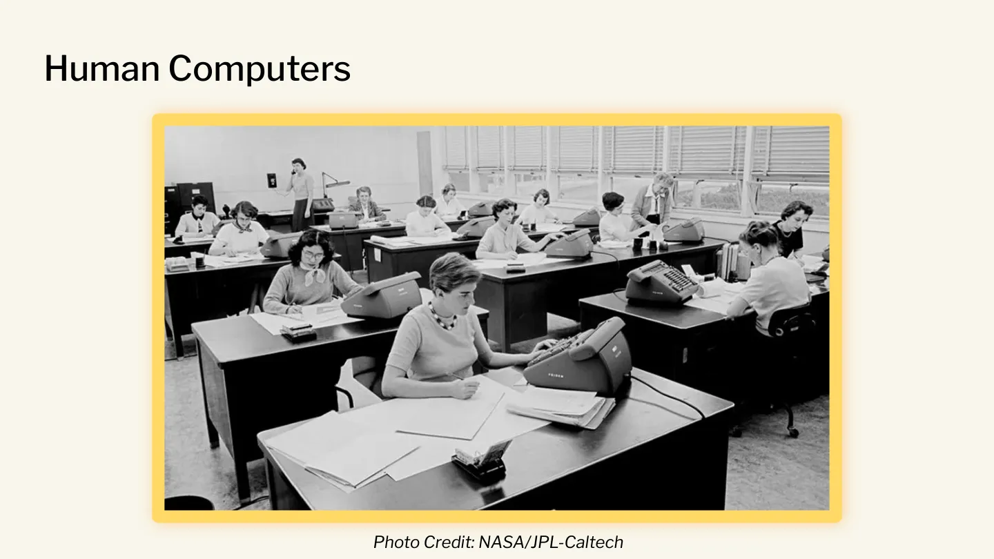 A NASA archival photograph of a roomful of human computers, women working at desks doing arithmetic by hand. Photo credit: NASA / JPL-Caltech. _